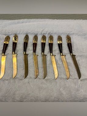 Set of eight vintage Siam Buddah wood and brass steak knives